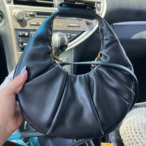 Staud leather hobo style crossbody can be worn without straps